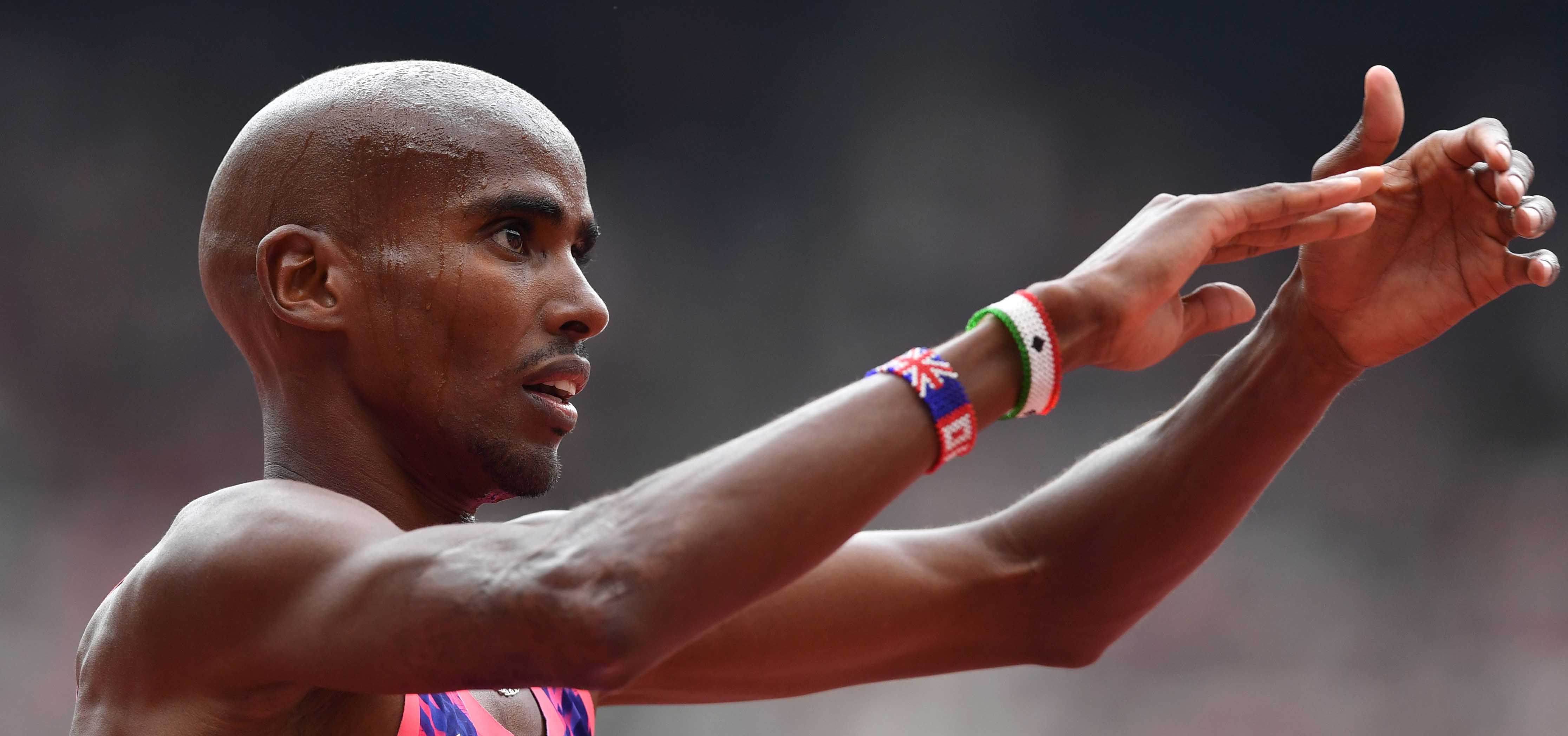 Britain's Mo Farah celebrates on the track after winning the men's 30