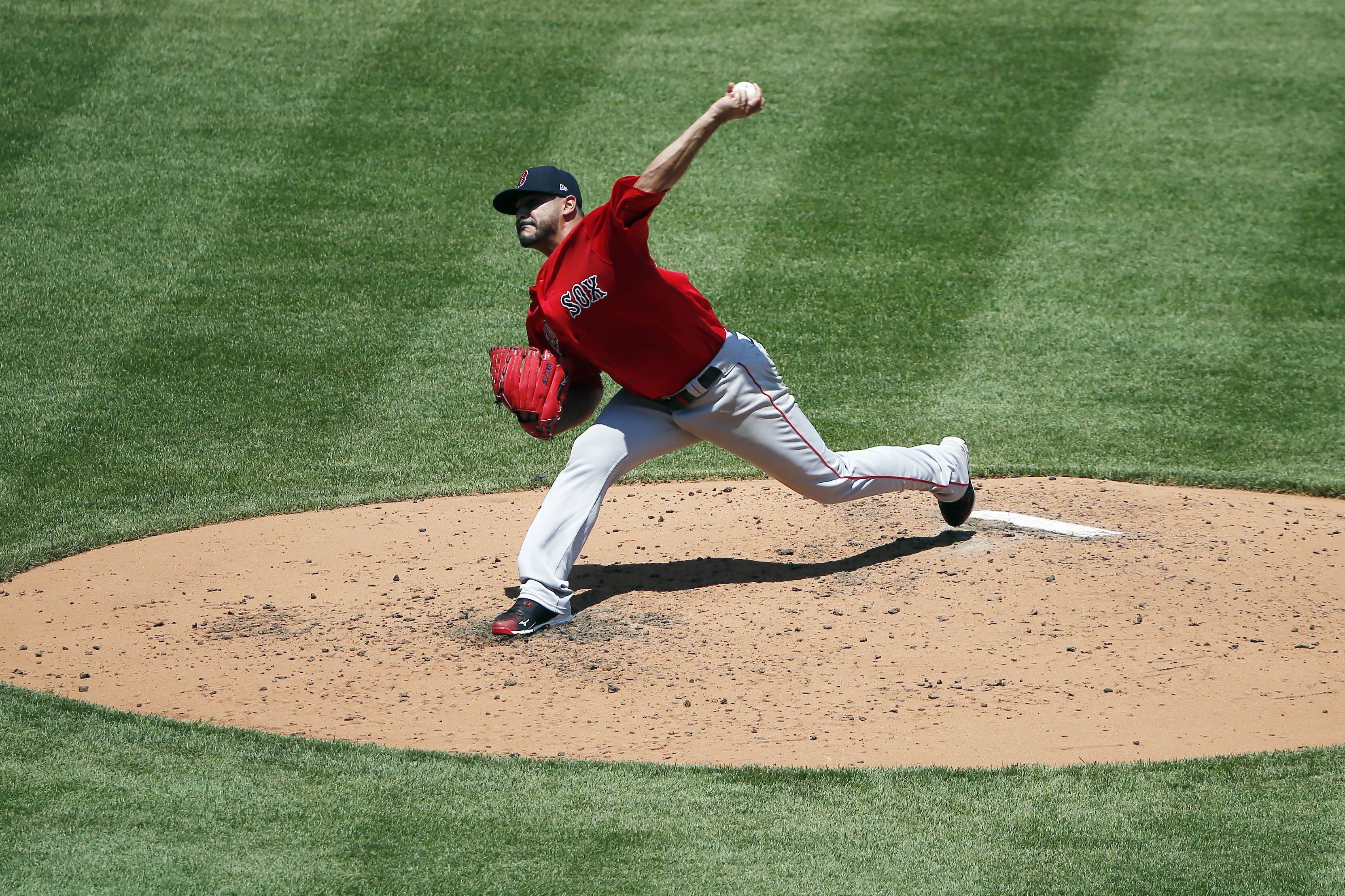 Boston Red Sox's Martin Perez makes cheese with hands at ranch