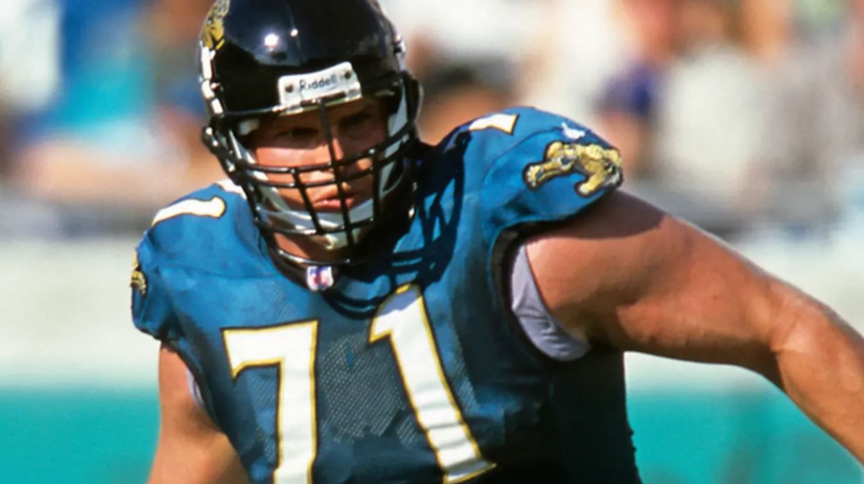 Former Jacksonville Jaguars offensive tackle Tony Boselli, center, stands  with members of his family after a ceremony, where he was presented with  his Pro Football Hall of Fame ring and had his