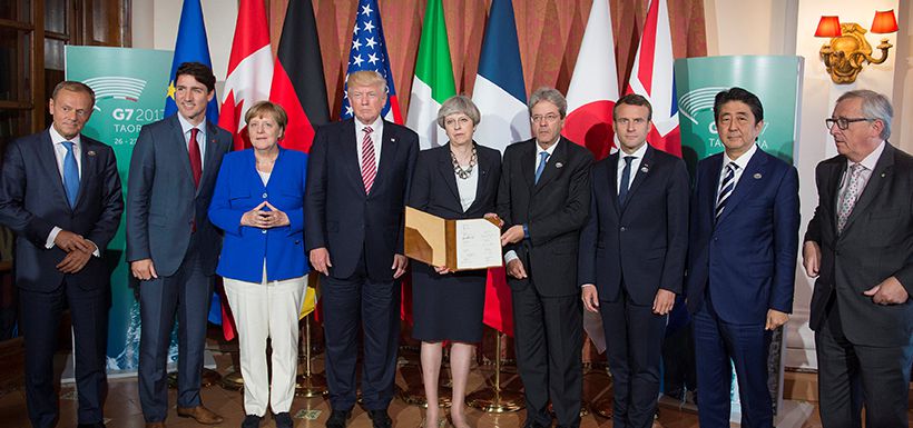 Leaders of the G7 pose after signing the 'G7 Taormina Statement on the Fight Against Terrorism and Violent Extremism' at the G7 summit in Taormina