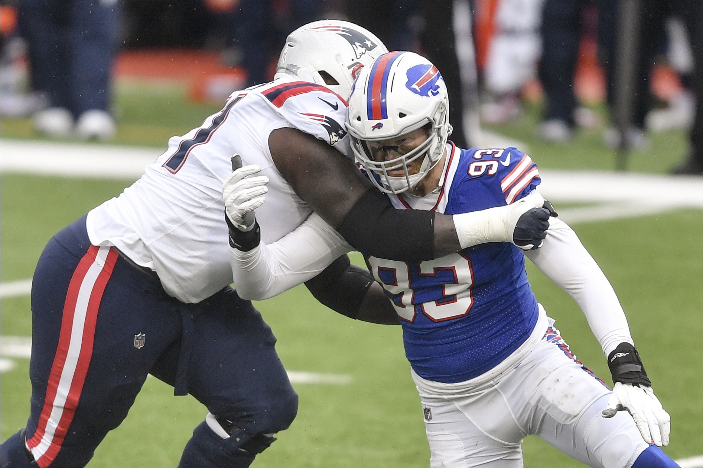 New England Patriots guard Mike Onwenu (71) blocks during an NFL