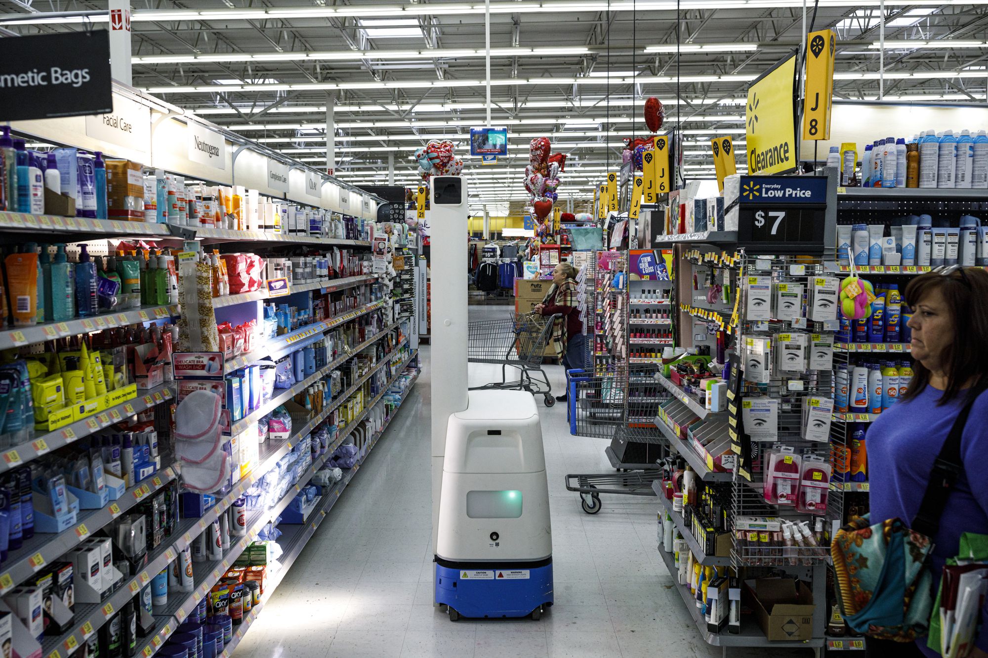 tall robot in grocery store