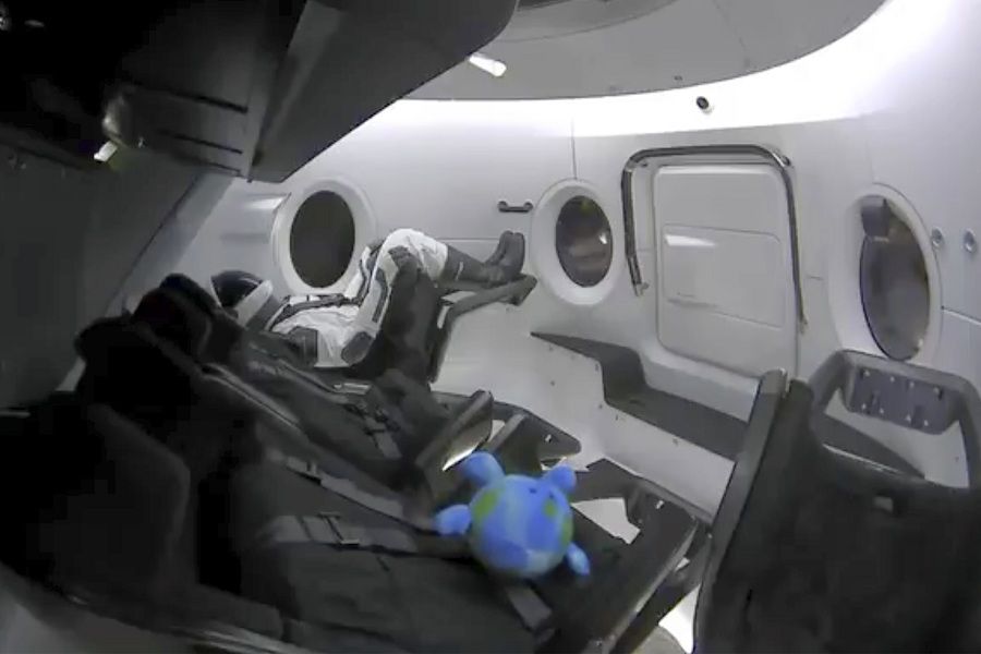 This photo provided by SpaceX shows a life-size test dummy along with