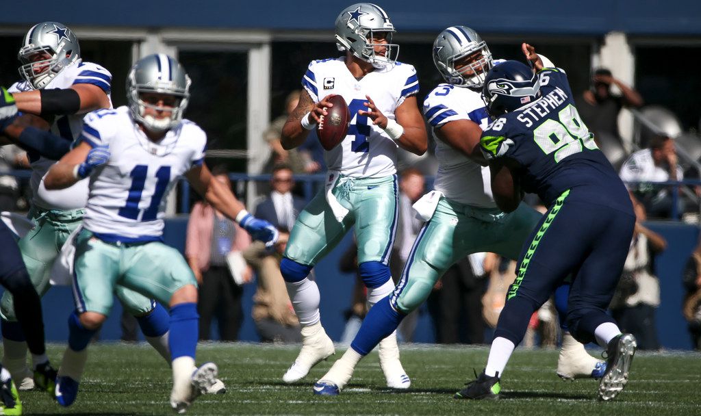 Seattle, WA, USA. 23rd Sep, 2018. Dallas Cowboys quarterback Dak Prescott (4)  before a game between the Dallas Cowboys and Seattle Seahawks at  CenturyLink Field in Seattle, WA. The Seahawks defeated the