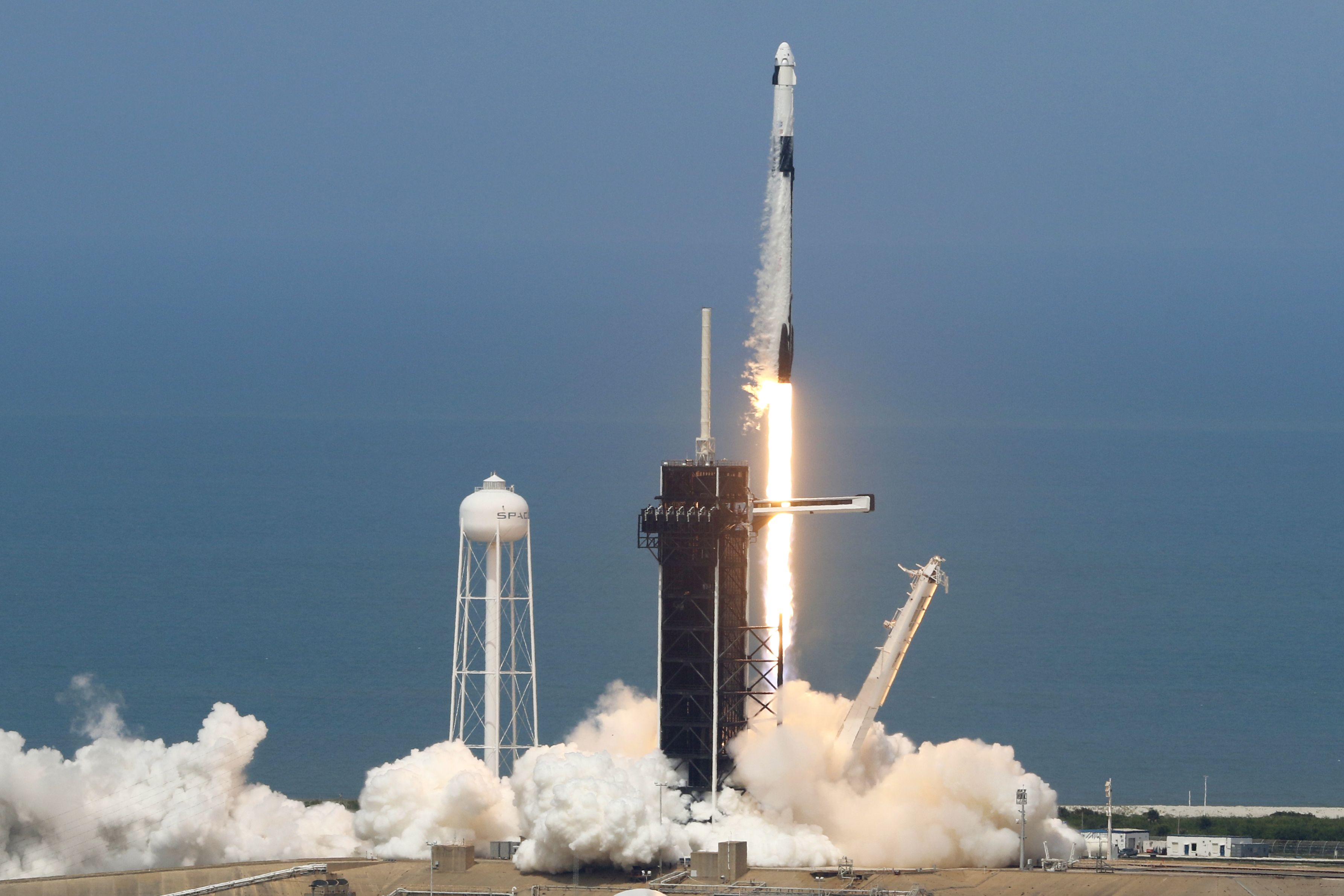 A SpaceX Falcon 9 rocket with the company's Crew Dragon spacecraft onboard lifts off from Kennedy Space Center, in Cape Canaveral, Florida