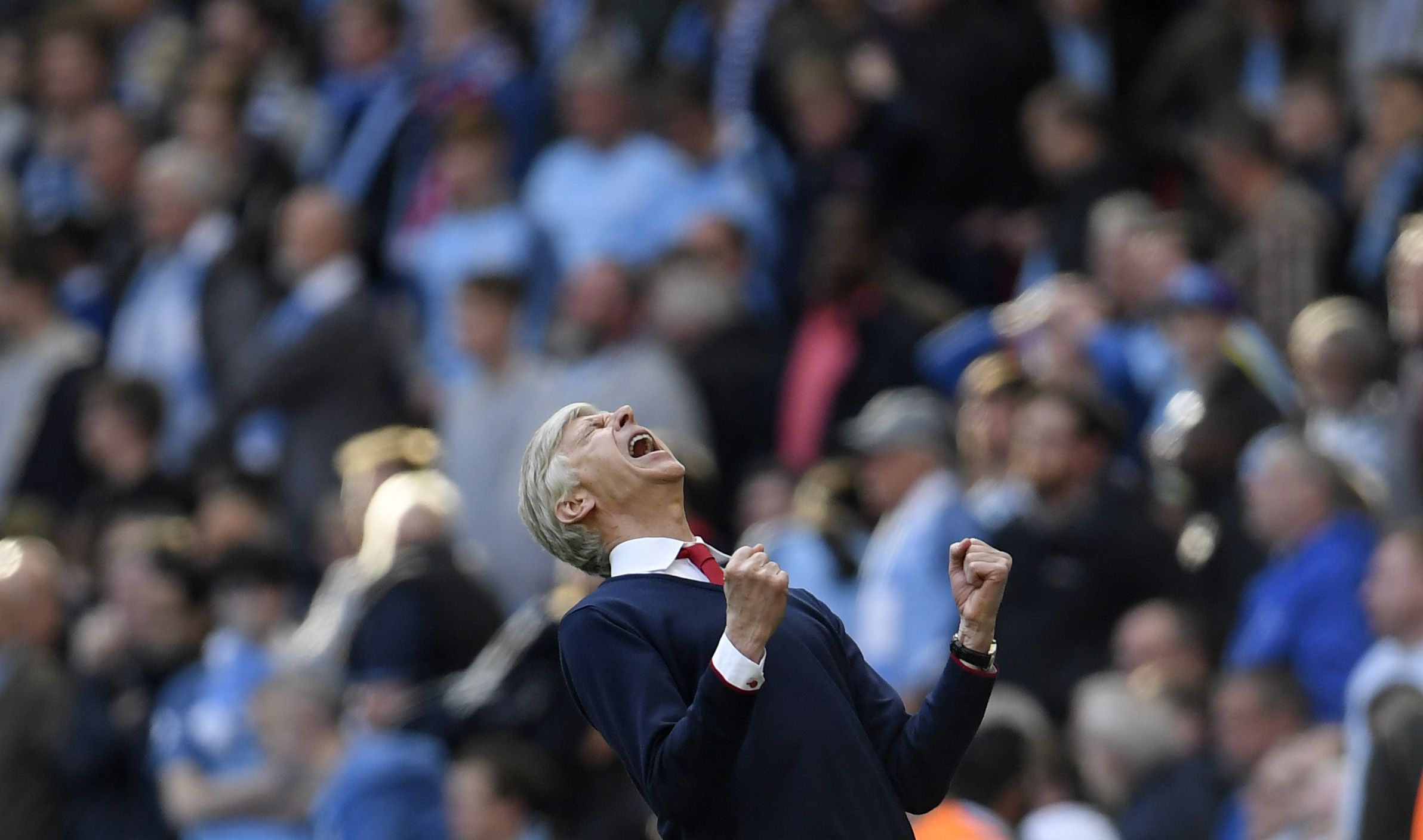 Arsenal manager Arsene Wenger celebrates after the match