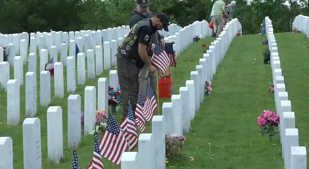 Marlborough scouts place flags on veterans' graves