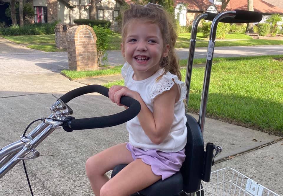 Girl with cerebral palsy can bike, thanks to local charity